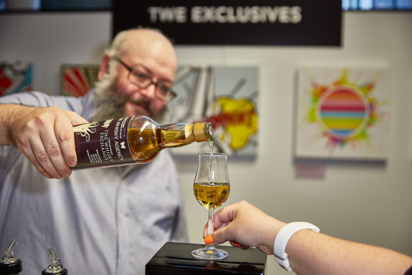 Billy Abbot pouring whiskey